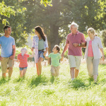 Multi-Generation Family Enjoying Walk In Beautiful Countryside